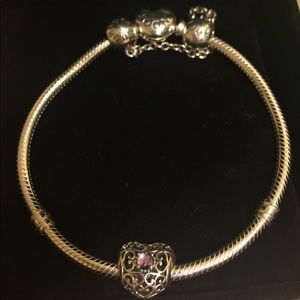 Pandora bracelet with amethyst heart charm